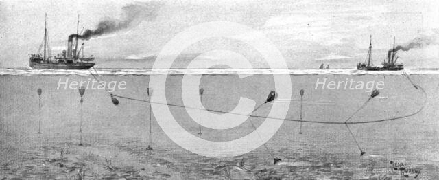 'La surveillance de la mer; Les Allemands ont deja seme, dans la mer du Nord, des mines', 1914. Creator: Henri Rudaux.