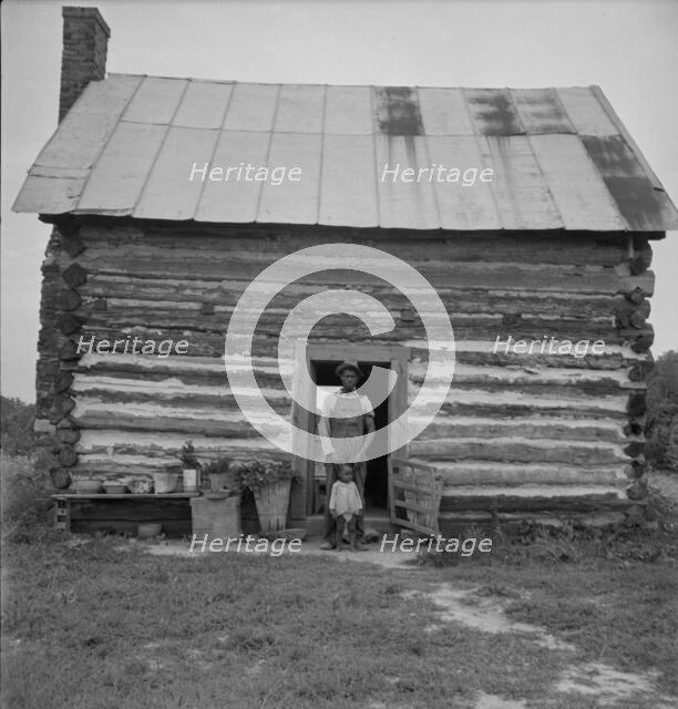 Possibly: Young sharecropper and his first child, Hillside Farm, Person County, North Carolina, 1939 Creator: Dorothea Lange.