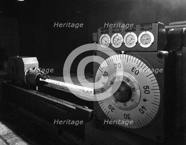 A continuous forge in operation at the Edgar Allen Steel Founders, Meadowhall, Sheffield, 1962.  Artist: Michael Walters
