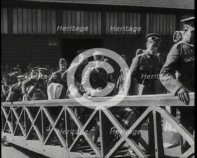 Male British Expeditionary Force Soldiers Walking up the Gangplank of a Ship in a British..., 1939. Creator: British Pathe Ltd.