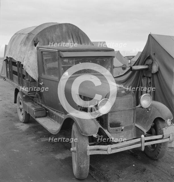 Truck, baby parked on front seat, Merrill, Klamath County, Oregon, 1939. Creator: Dorothea Lange.