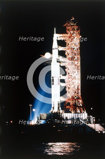Apollo 9 Saturn V rocket with full moon, 1969.  Creator: NASA.