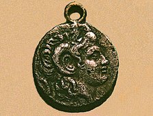 Silver coin with the head of Alexander the Great with the horns of the Egyptian god Amho, belongs…