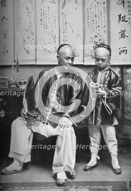 A Chinese schoolmaster and pupil, 1902. Artist: CC Pierce & Co.
