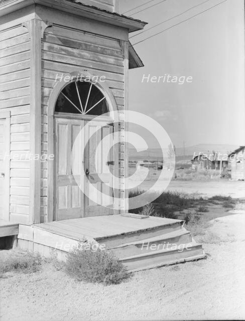 Old Catholic church on edge of potato town, Merrill, Klamath County, Oregon, 1939. Creator: Dorothea Lange.