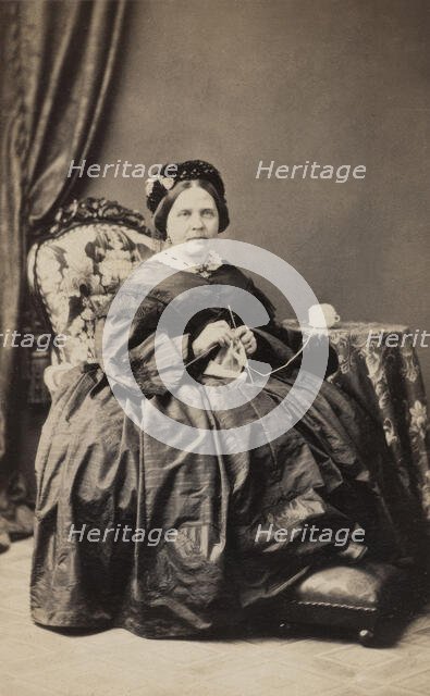 Business card, studio portrait of elderly woman knitting. (c1880s). Creator: Karolina Christianson.