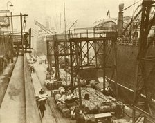 'Unloading Foodships at the Royal Albert Docks, London', c1930. Creator: Unknown.