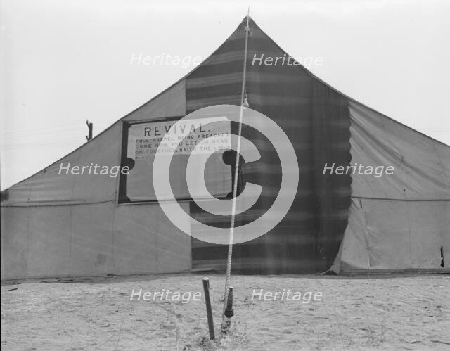 Revival meetings are held in Yakima shacktown, Sumac Park, Yakima, Washington, 1939. Creator: Dorothea Lange.