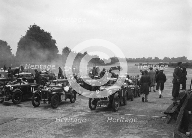 Cars on the starting grid for the Brighton & Hove Motor Club High Speed Trial, Brooklands, c1931. Artist: Bill Brunell.