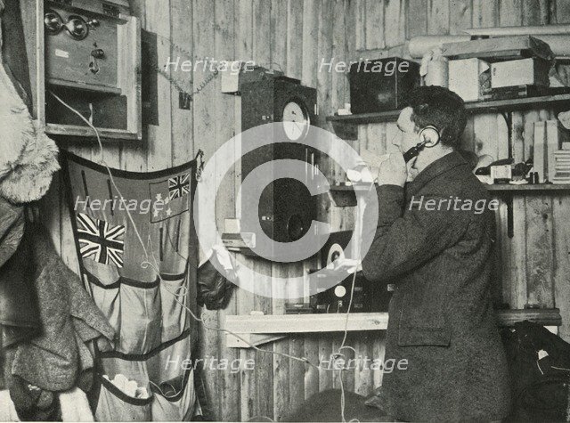 'Dr. Simpson in the Hut at the Other End of the Telephone Timing the Observation', c1911, (1913). Artist: Herbert Ponting.