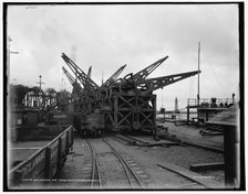 Unloading ore from whaleback, Buffalo, c1900. Creator: Unknown.