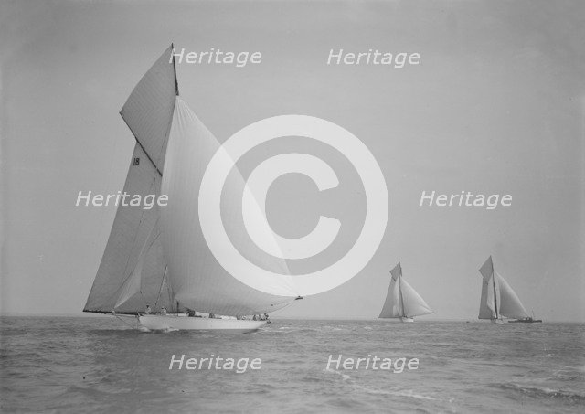 The cutter 'Onda' sailing under spinnaker, 1911. Creator: Kirk & Sons of Cowes.