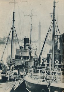 'Naval Trawler, HMS Liffy alongside a Grimsby fishing vessel in Grimsby Docks', 1937. Artist: Unknown.