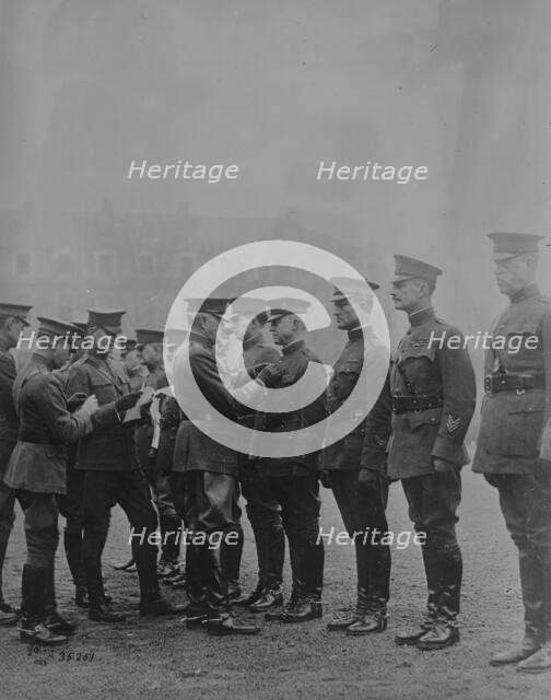 Pershing decorating Americans, Feb 1919. Creator: Bain News Service.