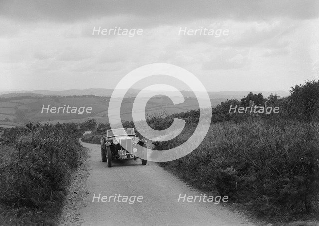 MG TA of RA MacDermid competing in the MCC Torquay Rally, 1938. Artist: Bill Brunell.