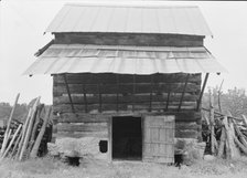 Tobacco barn with front shelter, Olive Hill, North Carolina, 1939. Creator: Dorothea Lange.