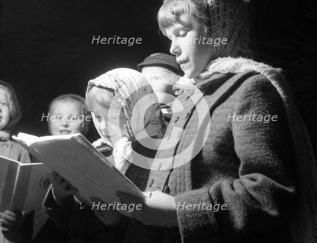 Carol singers, c1955. Creator: Arthur Charles Kirby Ware.