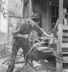 In Arkansas Hills (Ozarks) near Seligman, Missouri, splitting hickory for chair-bottoms, 1938. Creator: Dorothea Lange.