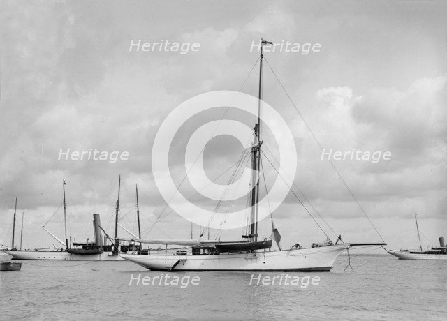 The cutter 'Yolande' at anchor, 1912. Creator: Kirk & Sons of Cowes.