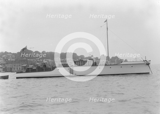 The 12 ton motor yacht 'Cordon Rouge' at anchor, 1923. Creator: Kirk & Sons of Cowes.