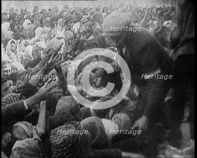 Greek People Jostling for Red Cross Food Hand Outs, 1922. Creator: British Pathe Ltd.