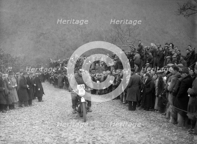 347 cc AJS of RW Cassam competing in the MCC Lands End Trial, Beggars Roost, Devon, 1936. Artist: Bill Brunell.