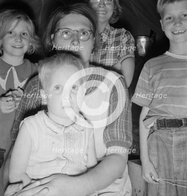 Family of six in tent after supper, FSA mobile unit, Merrill, Klamath County, Oregon, 1939 Creator: Dorothea Lange.