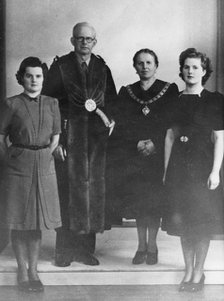 Margaret Thatcher (then Margaret Hilda Roberts), pictured with her parents and sister Muriel in 1945 Artist: Unknown