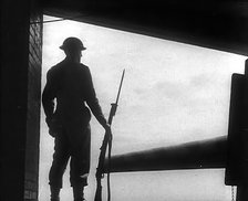 A British Soldier Guarding a Gun Emplacement, 1940. Creator: British Pathe Ltd.