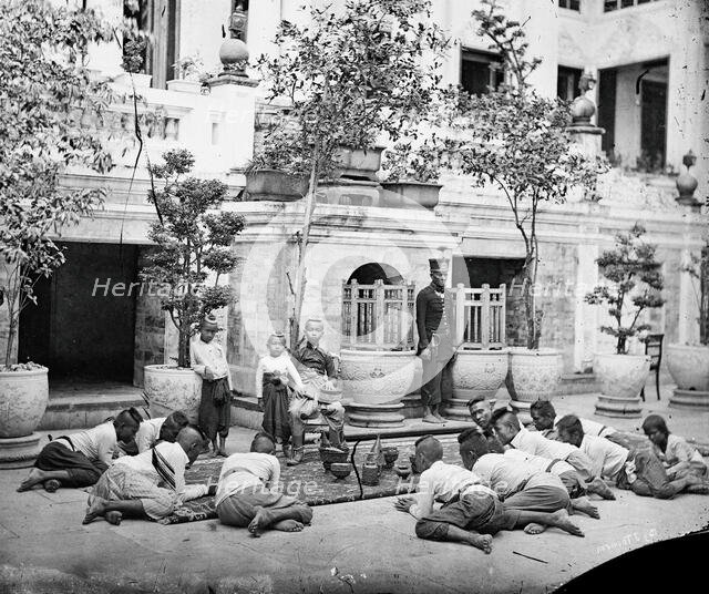 Prince Chulalongkorn of Siam [Thailand] (seated, centre), with Prince Bhanugrangsi Savan..., 1866. Creator: John Thomson.