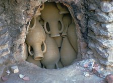 Pottery in a kiln before firing in Tunisia. Artist: Unknown