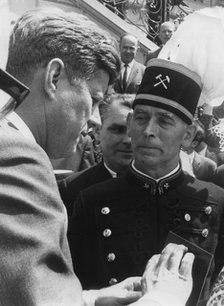A German miner presenting President John F. Kennedy with a mine lamp, Bonn, Germany, 1963. Artist: Unknown
