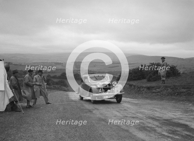 Riley Kestrel of A Bassett competing in the South Wales Auto Club Welsh Rally, 1937 Artist: Bill Brunell.