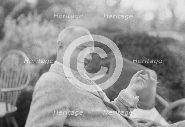 Clucas, E.W., seated outdoors, 1931 June 14. Creator: Arnold Genthe.