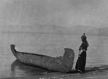 On the shore of the lake-Kutenai, c1910. Creator: Edward Sheriff Curtis.