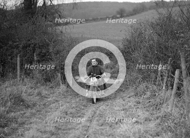 600 cc Ariel Square Four of HLS Sikes competing in the Inter-Varsity Trial, November 1931. Artist: Bill Brunell.