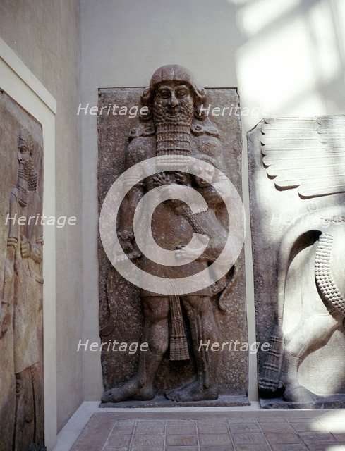 Assyrian sculpture of Gilgamesh holding a lion, Khorsabad, c8th century BC. Artist: Unknown
