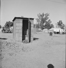 Sanitary facilities in camp of carrot pullers, near Holtville, Imperial Valley, California, 1939. Creator: Dorothea Lange.