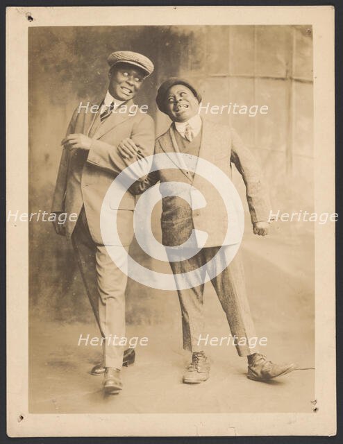 Photograph of two men linking arms, 1910s - 1920s. Creator: The Bell Studio.