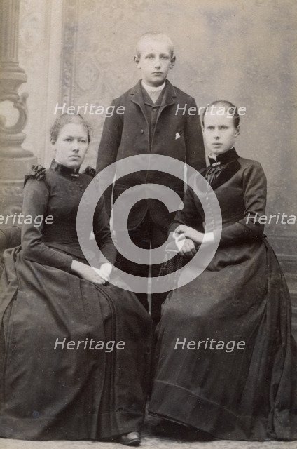 Studio portrait of three siblings, c1900. Artist: Unknown