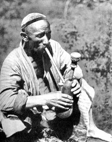 Uzbek man smoking calian, Samarkand, 1936. Artist: Unknown