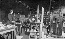 JJ Thomson, British physicist, at work in the Cavendish Laboratory, Cambridge. Artist: Unknown