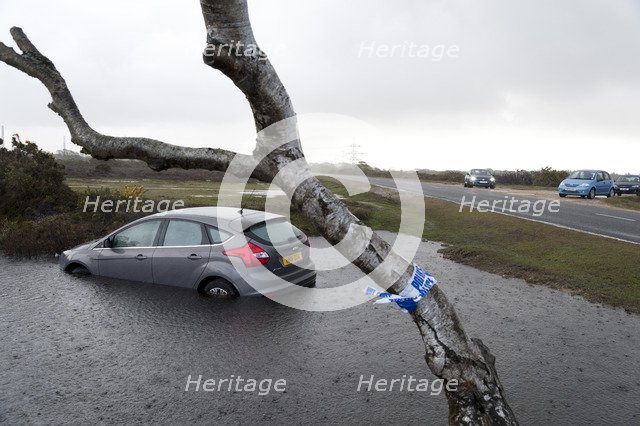 Ford Focus in flooded ditch after losing control on wet road 2012 Artist: Unknown.