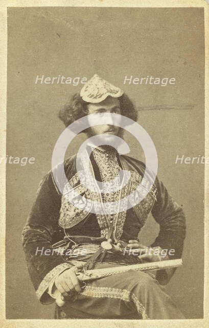 Three-quarter portrait of man, seated, facing right, between 1870 and 1886. Creator: Unknown.