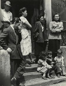 Group of men, women and children gathered on stoop, East Harlem, New York City, 1947 - 1951. Creator: Romulo Lachatanere.