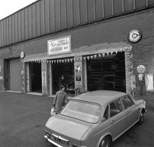 Mk 1 BMC Austin 1800 outside a tyre fitting bay in Rotherham, South Yorkshire, 1969. Artist: Michael Walters