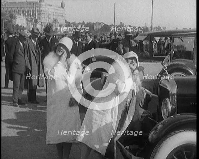 Two Female Civilians Wearing Glamorous Outfits Powdering Their Noses Using a Luxurious..., 1920. Creator: British Pathe Ltd.