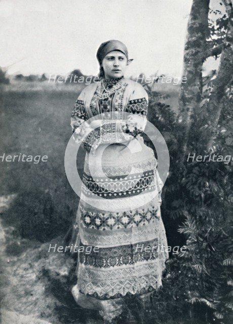 A Russian peasant in costume, 1912. Artist: Unknown.