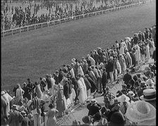 A Large Crowd of Civilians Watching a Horse Race, 1920. Creator: British Pathe Ltd.