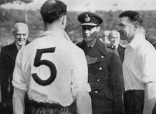 English footballer Eddie Hapgood meeting King George VI, c1937-c1944. Artist: Unknown